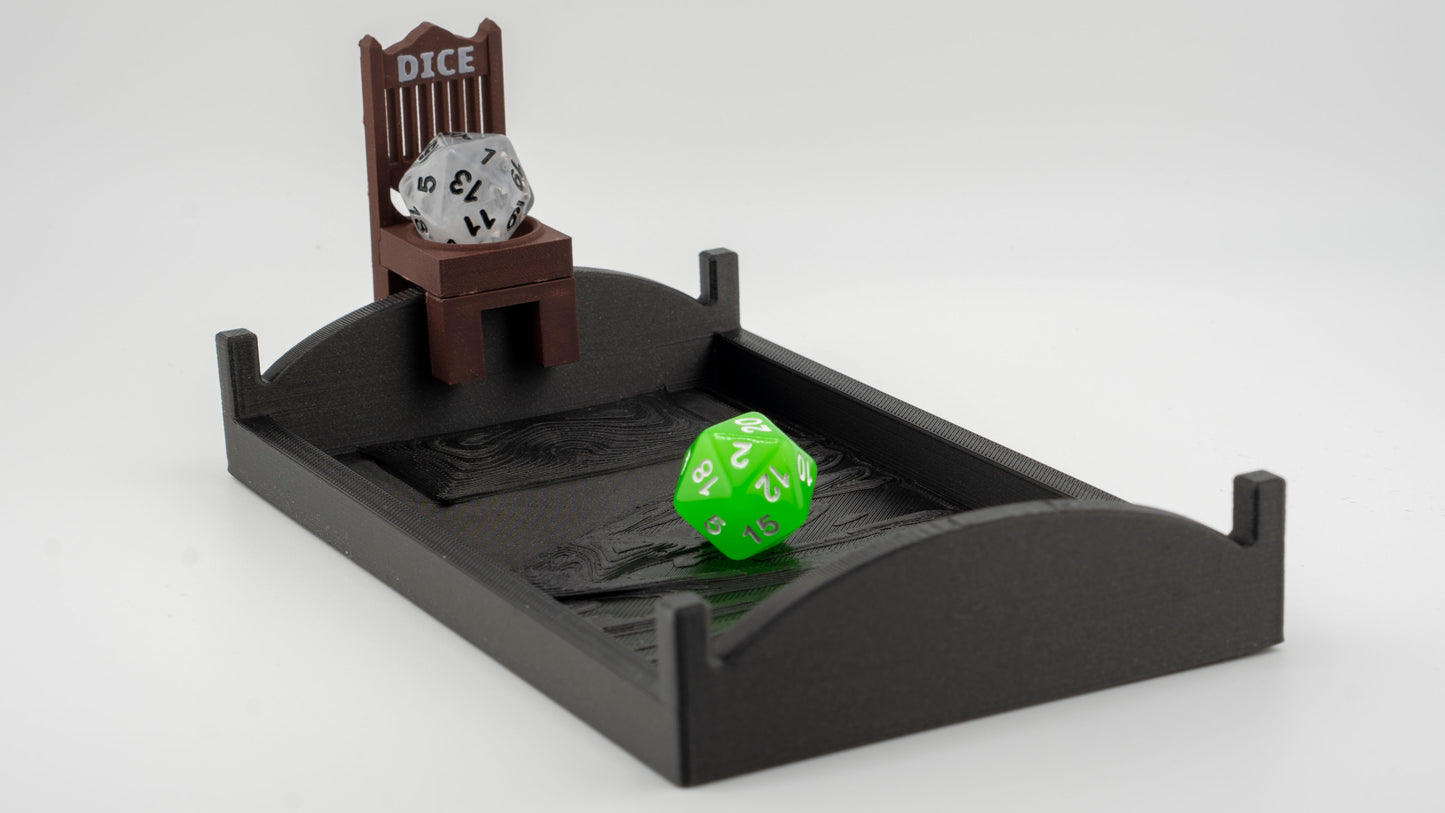 A bed shaped dice rolling tray with a dice cuck chair affixed to the headboard.