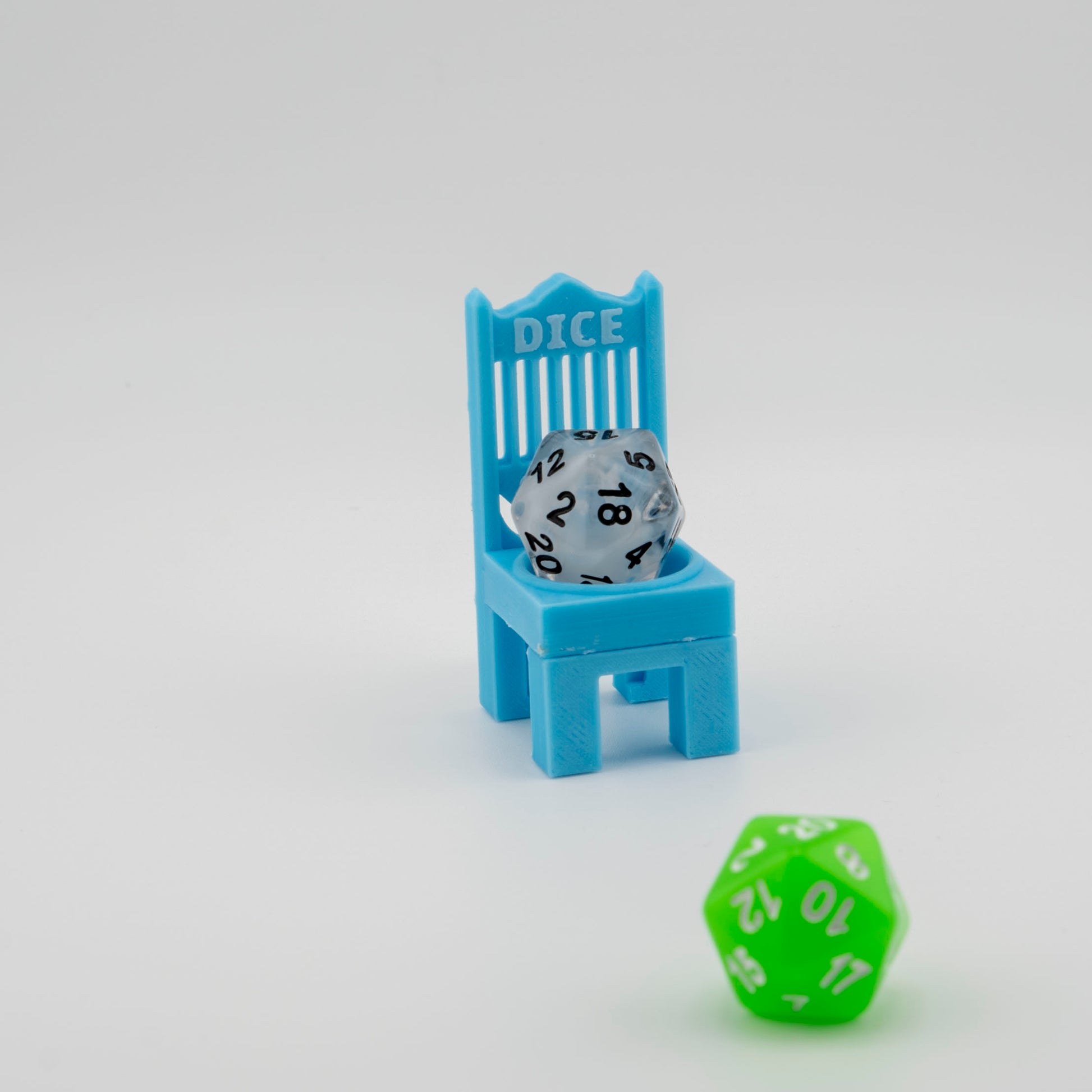 A blue glow in the dark dice cuck chair with a d20 in it